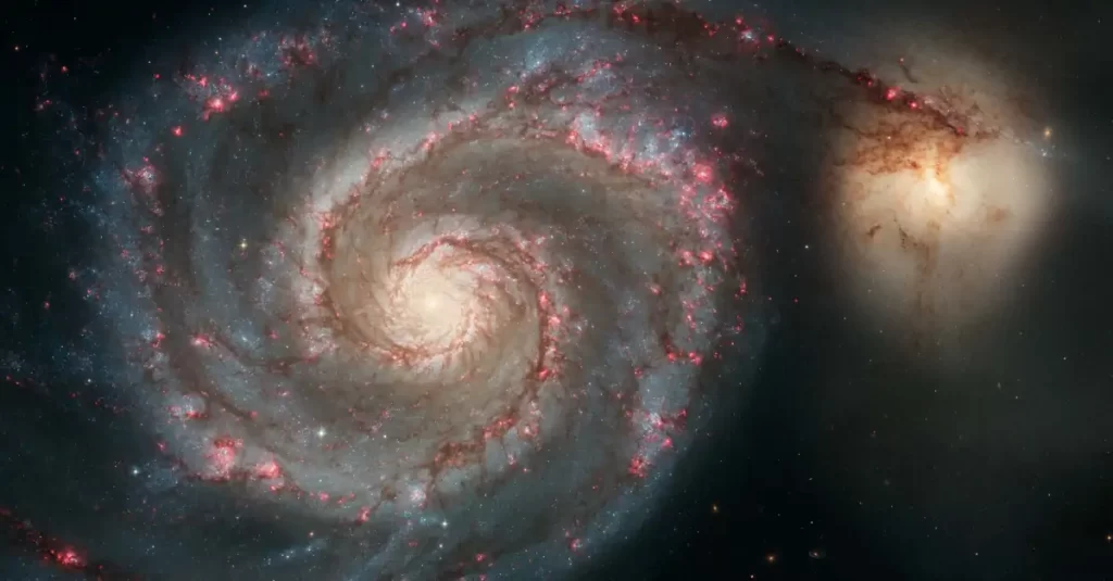 Foto da galáxia M51, captada pelo Telescópio Espacial Hubble.
