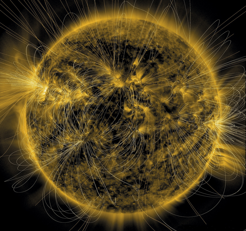 Ilustração sobre imagem real mostra as linhas do complexo campo magnético na superfície do Sol. Imagem: NASA / SDO / AIA / LMSAL