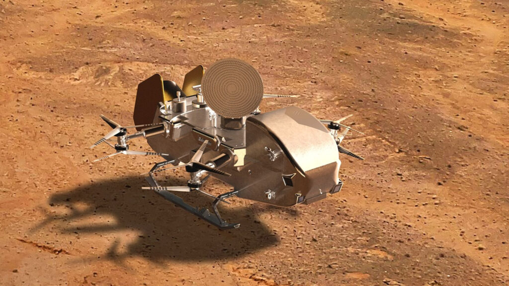 NASA define onde seu “drone” nuclear vai pousar em Titã 1 Ilustração da sonda Dragonfly na superfície da lua Titã (Crédito: NASA)