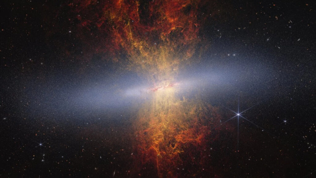 Foto da Galáxia M82, também conhecida como "Galáxia do Charuto". Imagem: NASA/ESA/CSA