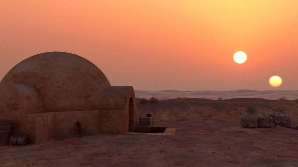 Imagem do planeta fictício de Star Wars Tatooine, que orbita duas estrelas. 